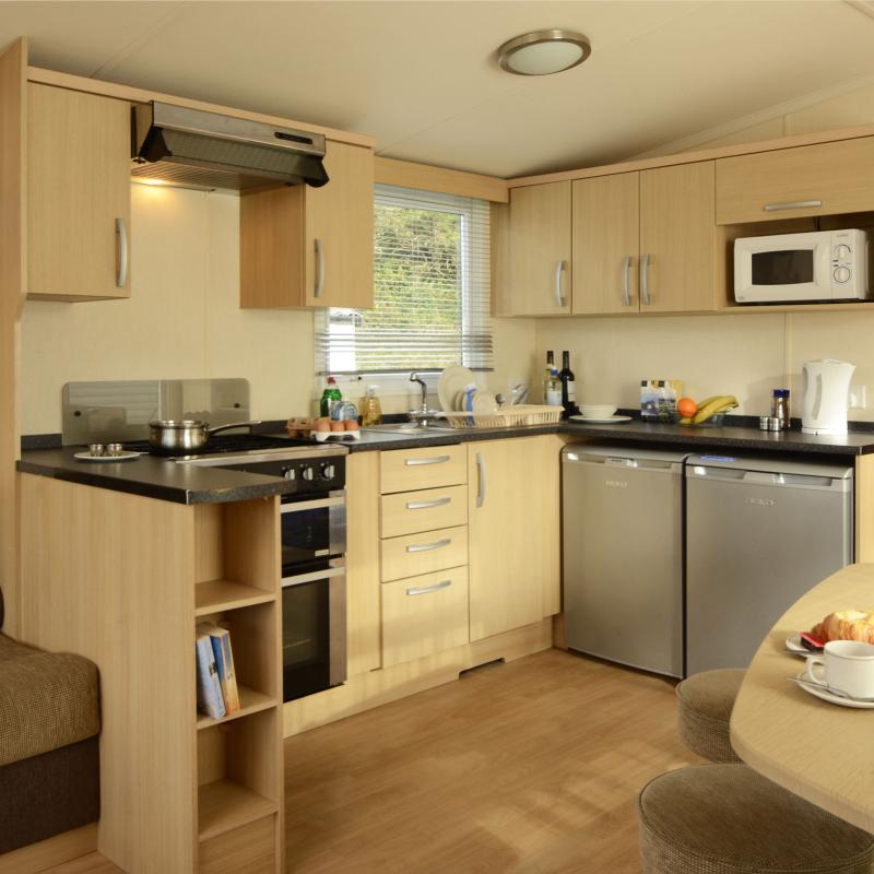 The kitchen and dining area in one of the Atlantic Silver Caravans at Woolacombe Sands Holiday Park