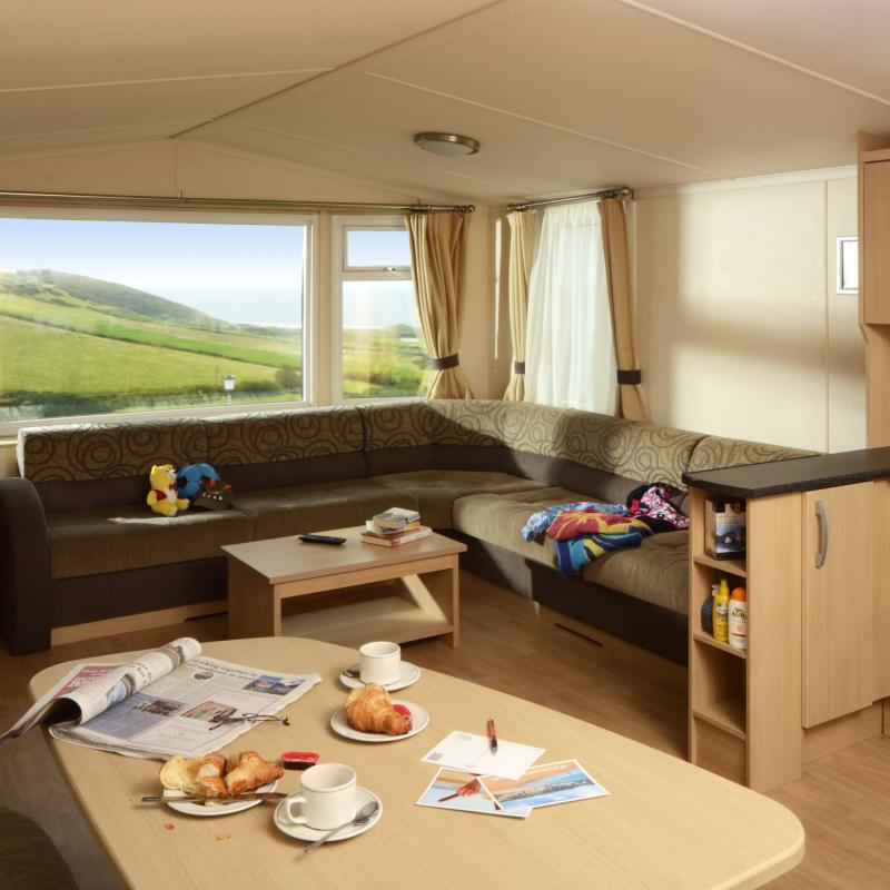 The Living and dining area overlooking Woolacombe beach in an Atlantic Silver Caravan at Woolacombe Sands Holiday Park